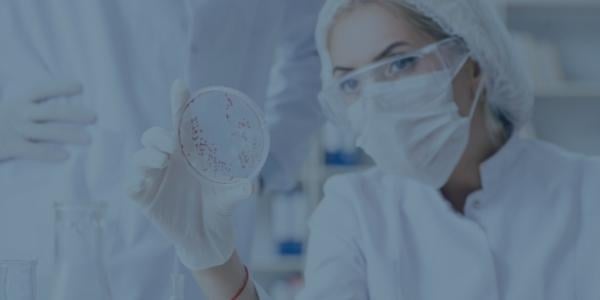 A clinical lab worker looking at a sample