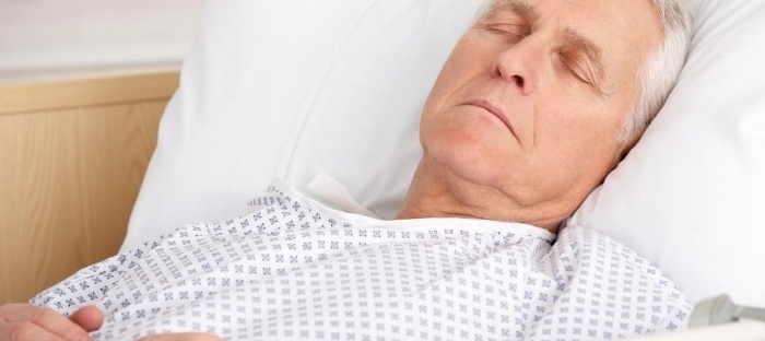 older-man-sleeping-in-hospital-gown-in-bed-553541-edited-030460-edited.jpg